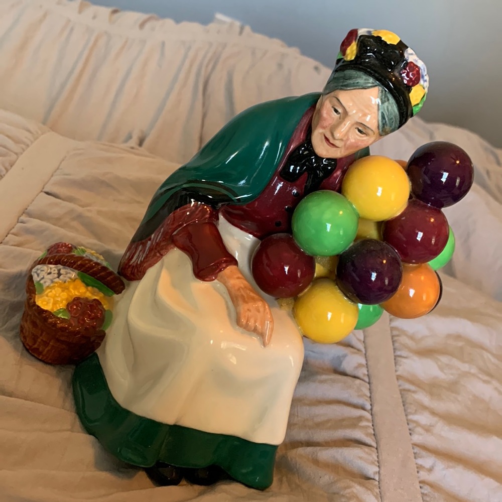 Vintage Royal Doultan balloon seller.